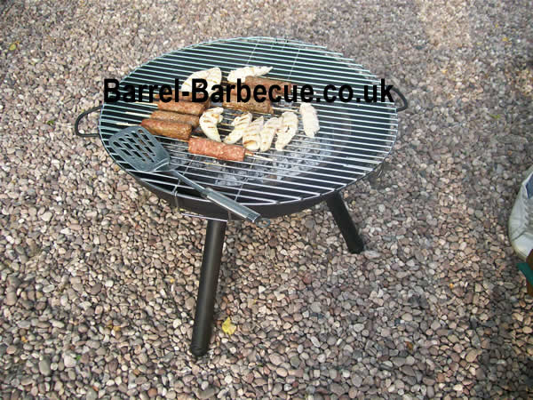 fire pit kettle with burgers